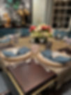 Sophisticated event setup by Chef Missy Keyser, showcasing a meticulously arranged buffet with gourmet food and stylish decor.