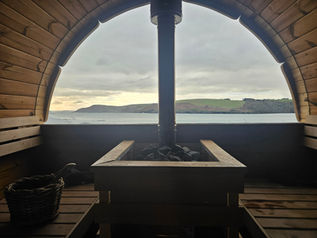 relaxing in a wood-fired sauna in Myhaven Oysterhaven County Cork