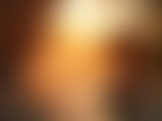 woman in a hot tub next to a wooden cabin sauna