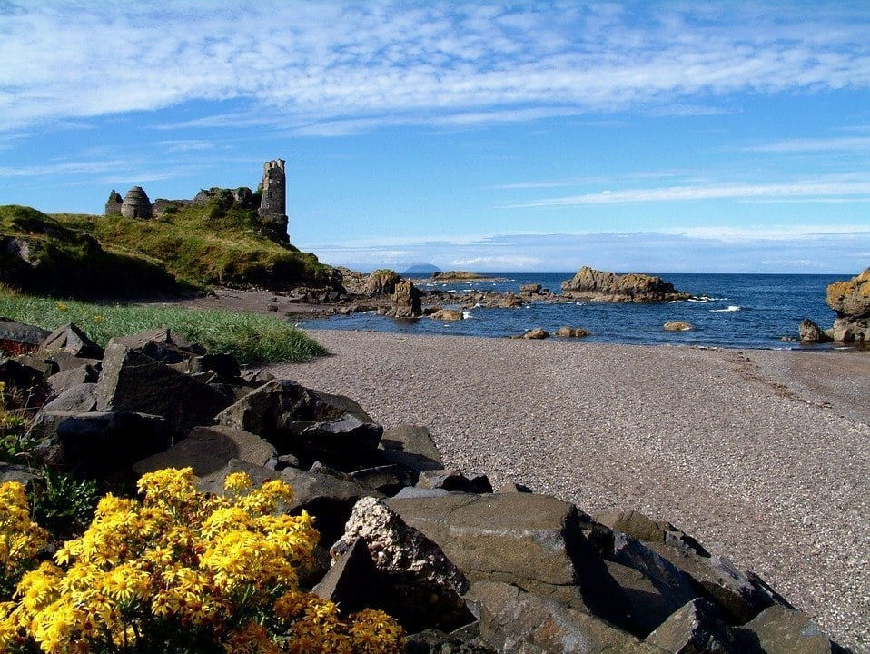 Exploring Dunure Castle ruins on a sunny day