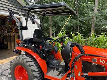 Kubota on extended Easy struts.jpeg