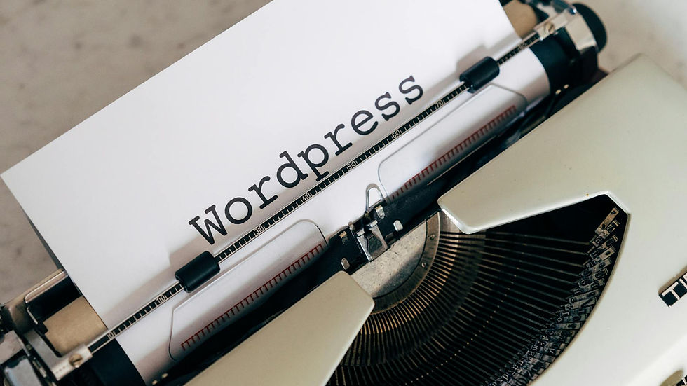 Close-up of a vintage typewriter with a paper displaying 'WordPress', ideal for blogging and writing concepts.