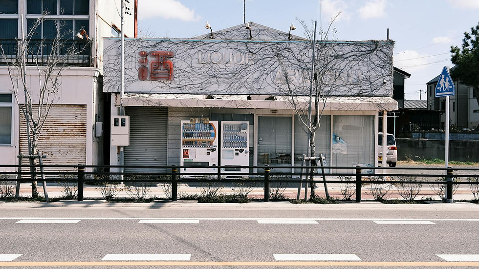 Vending machines and storefront on a quiet street in Gamagōri, Japan.