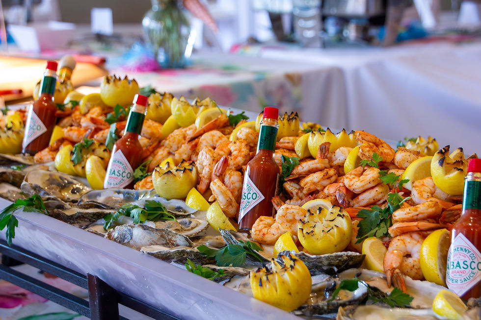 A seafood display featuring shrimp, oysters, grilled lemons, parsley, and bottles of Tabasco, set up for the Mother’s Day Brunch at Metropolis Ballroom.