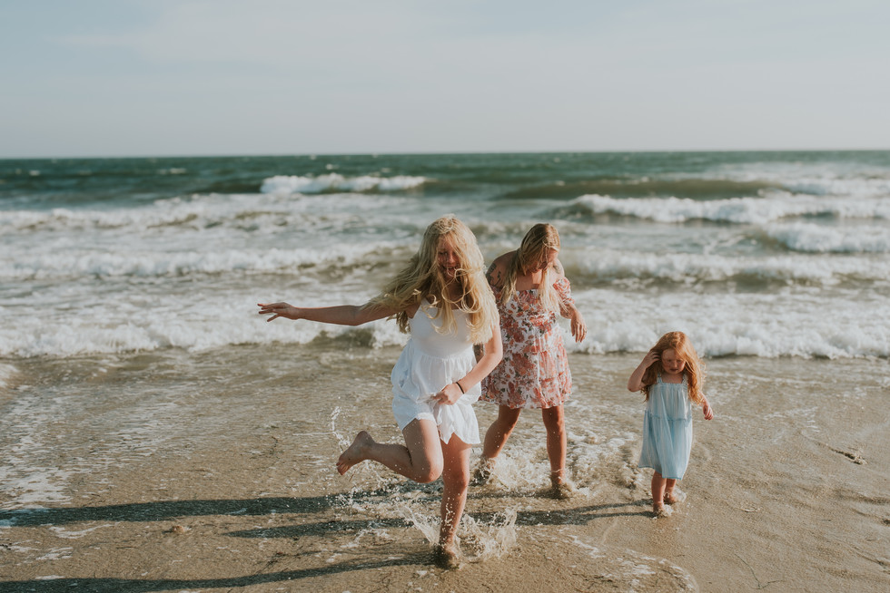children running along the shoreline at Horseneck Beach