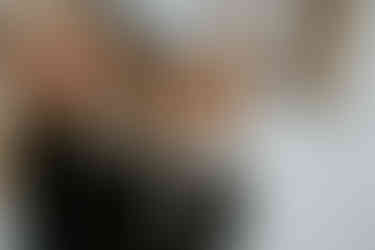 mom snuggling her corgi