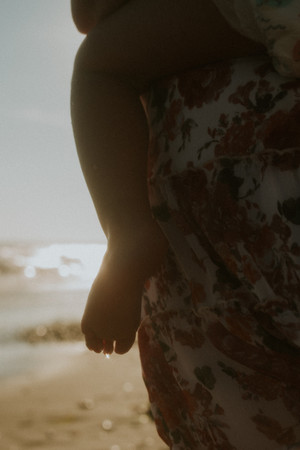 unposed family moments during summer beach session