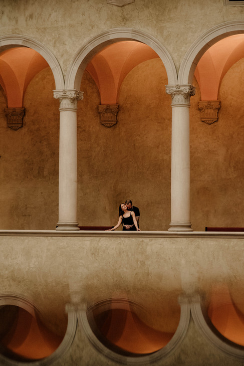 couple reflection under marble arches at Worcester art museum