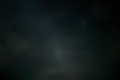 the night sky is filled with stars and clouds.webp