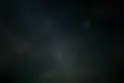 the night sky is filled with stars and clouds.webp