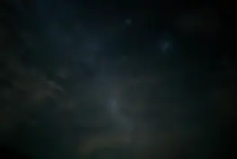the night sky is filled with stars and clouds.webp