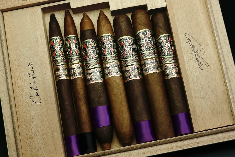 Close-up view of a single Opus X cigar resting on a wooden surface
