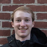 Milford_Headshot_Brick (1).JPG