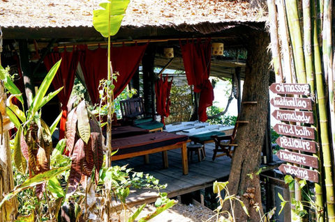 Massage and gardening area in fandee guesthouse luang prabang