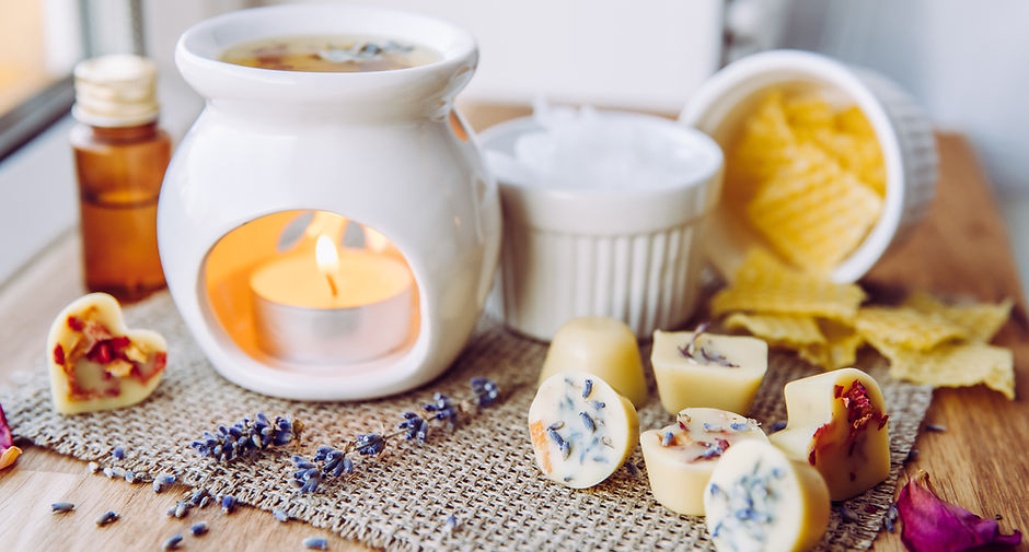 Using homemade mini wax melts in aromatherapy lamp diffuser at home interior concept. Melt