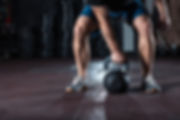 Kettlebell crossfit training in gym. Athlete doing workout.jpg