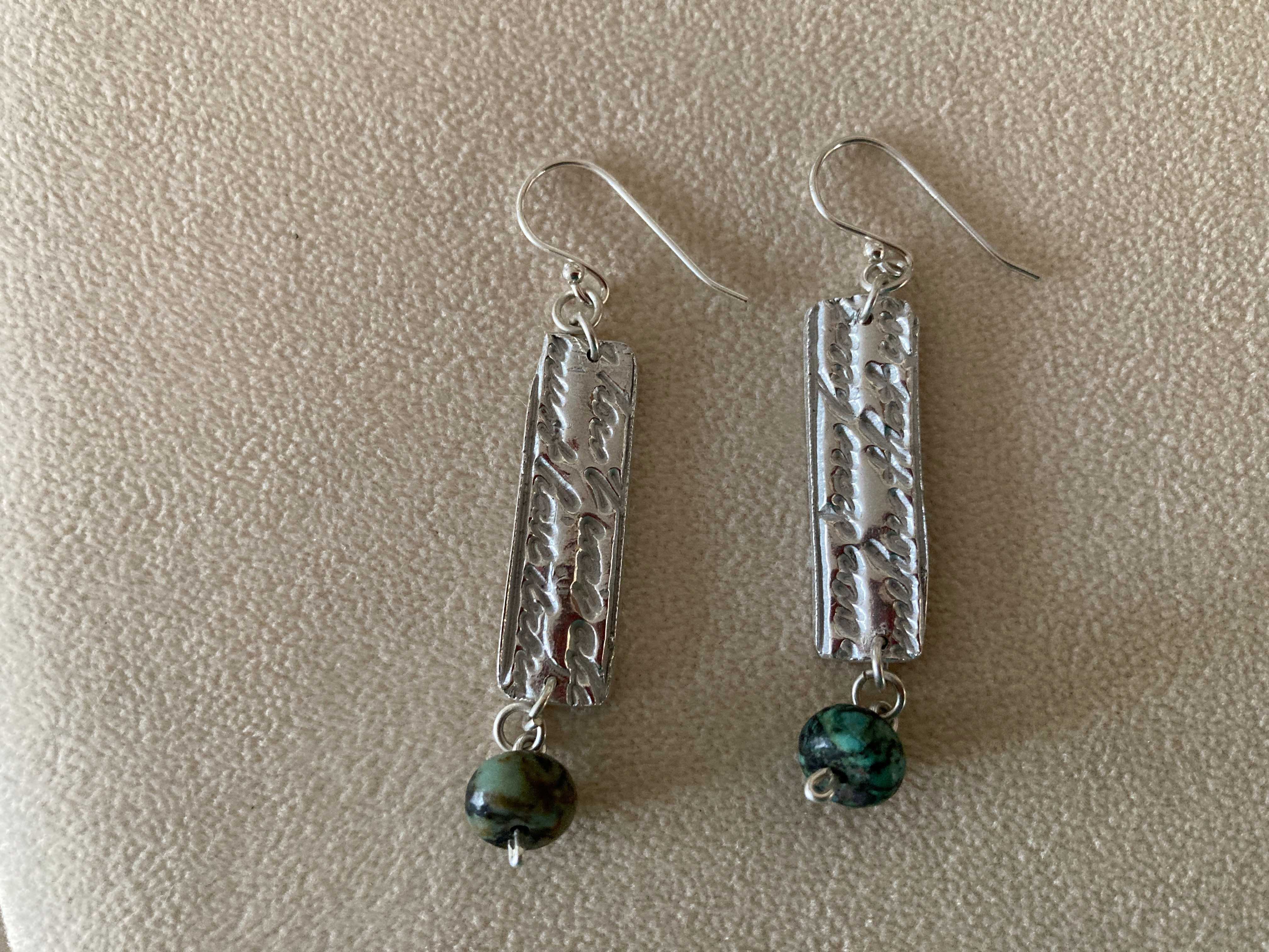 sterling silver dangle earrings.