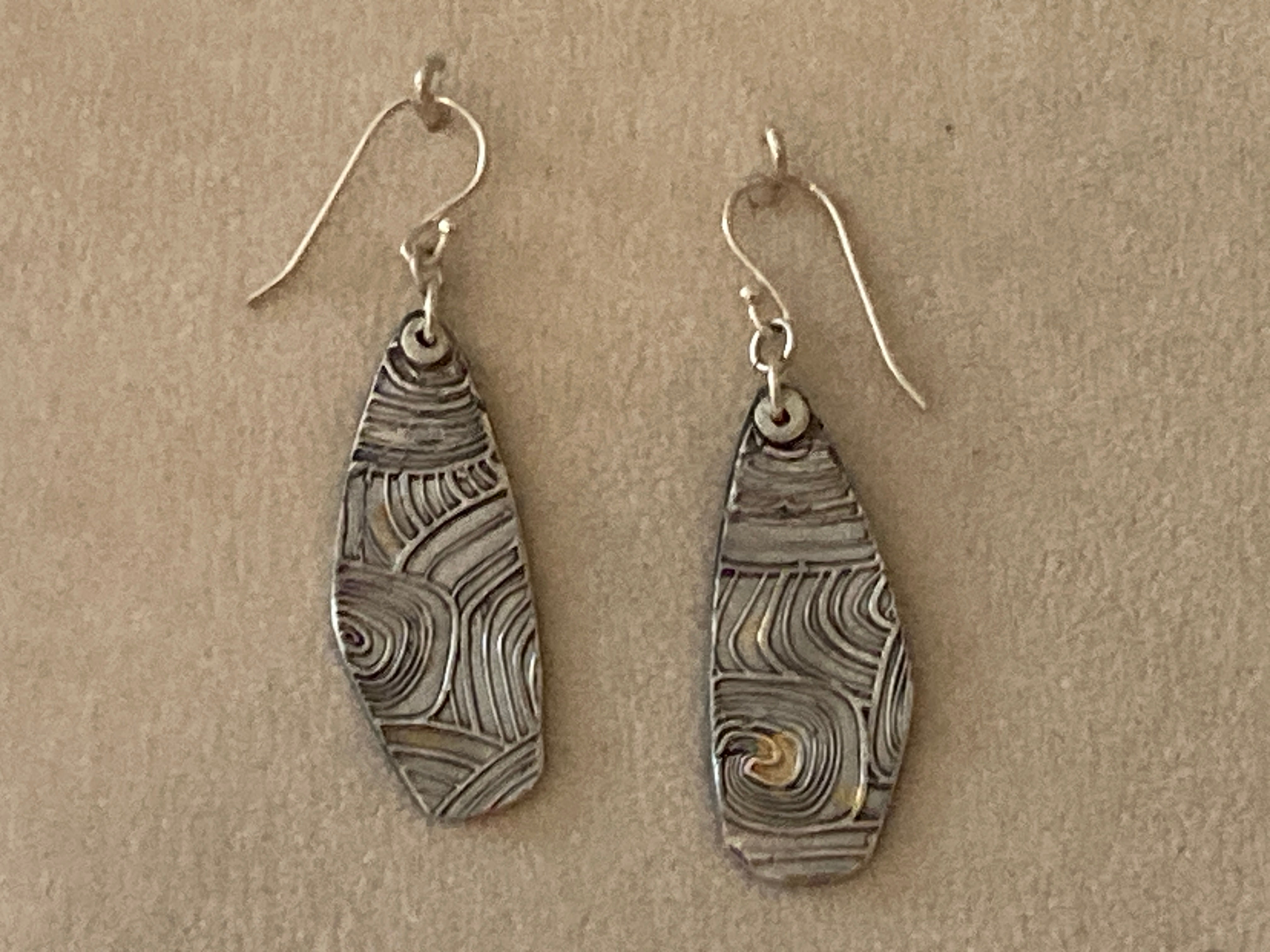 Sterling silver drop earring with 24k gold leaf.