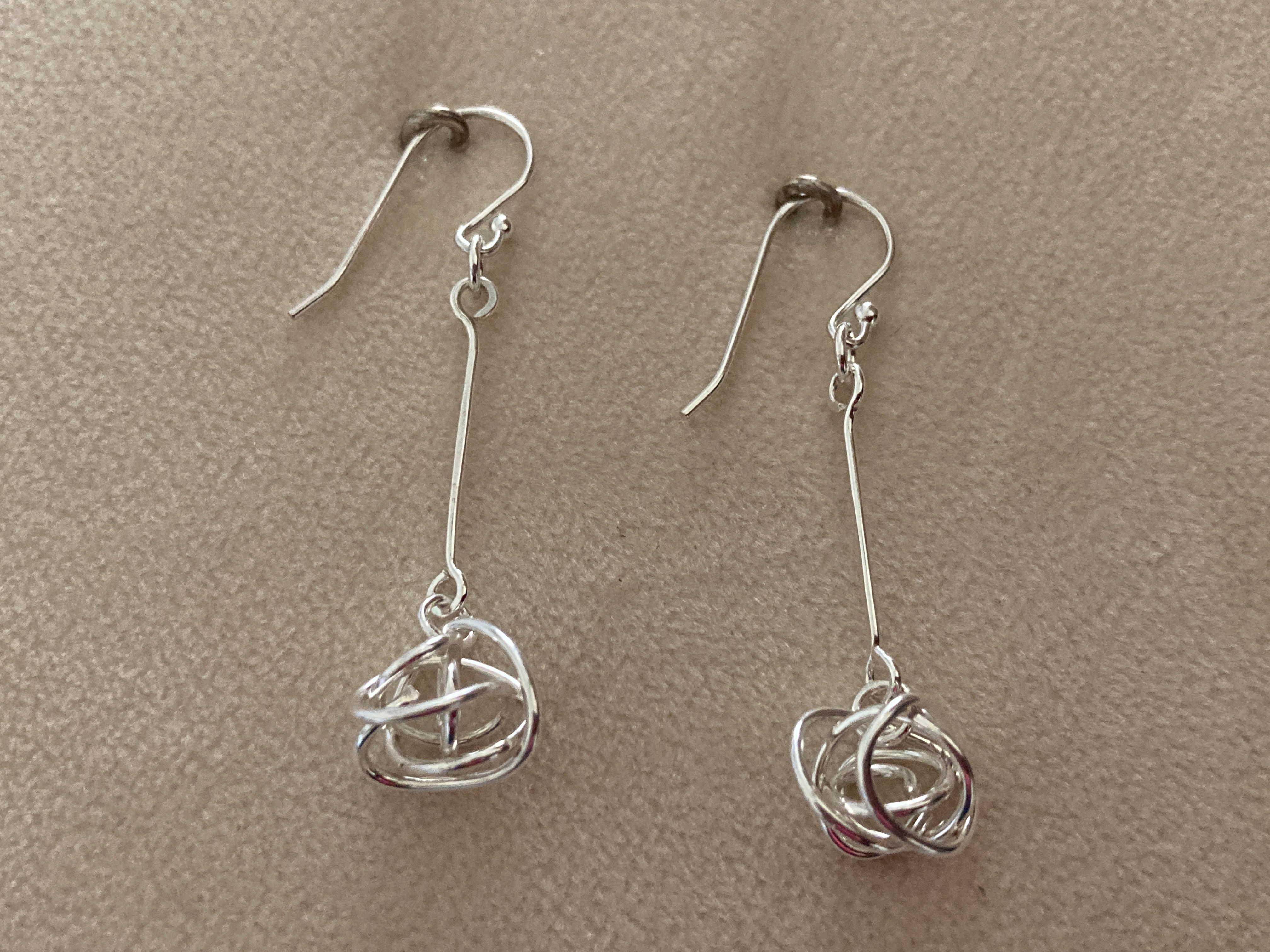 Sterling silver dangle earrings.