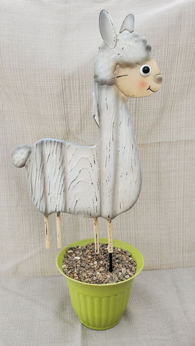 White llama garden stake in a green planter