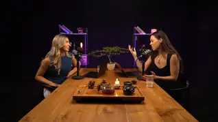 two women doing podcast with table and Chinese tea ceremony