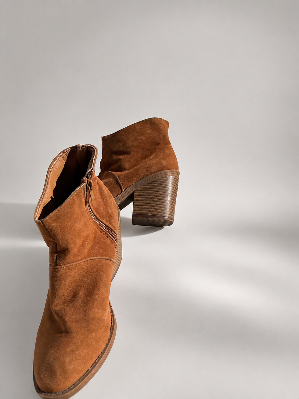 Thumbnail: Font view of Utopia ankle boot showing side zip and soft faux suede upper.