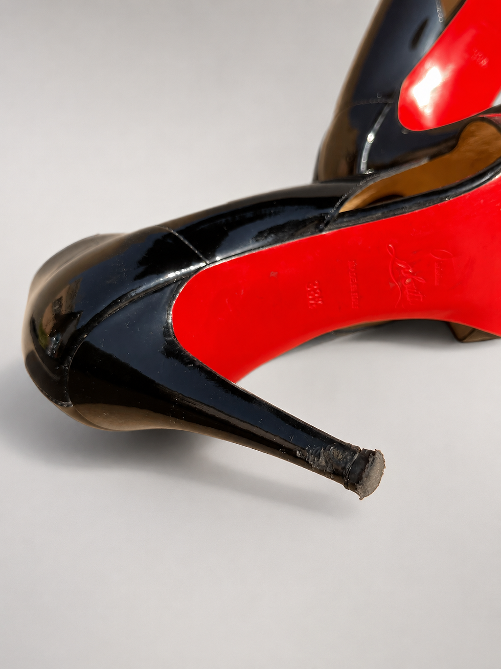 Thumbnail: Christian Louboutin Crève Coeur 100 Pumps UK 5.5 close-up of signature red sole and heel