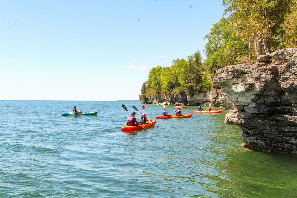 group of kayakers at cave point county park in door county, wi — tour photography by Shutter & Sojourn
