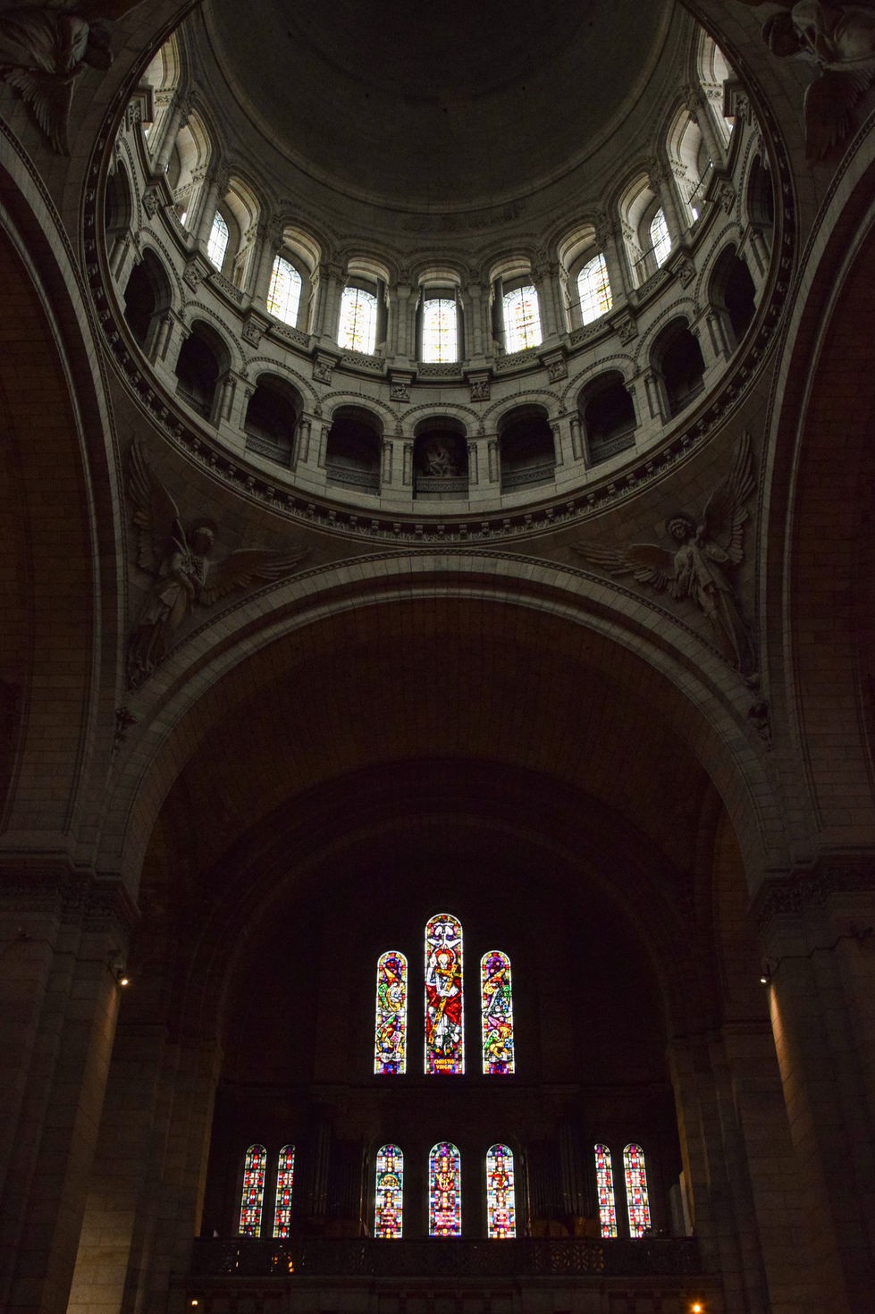 dark domed church ceiling with arched, stained glass windows — travel photography by Shutter & Sojourn