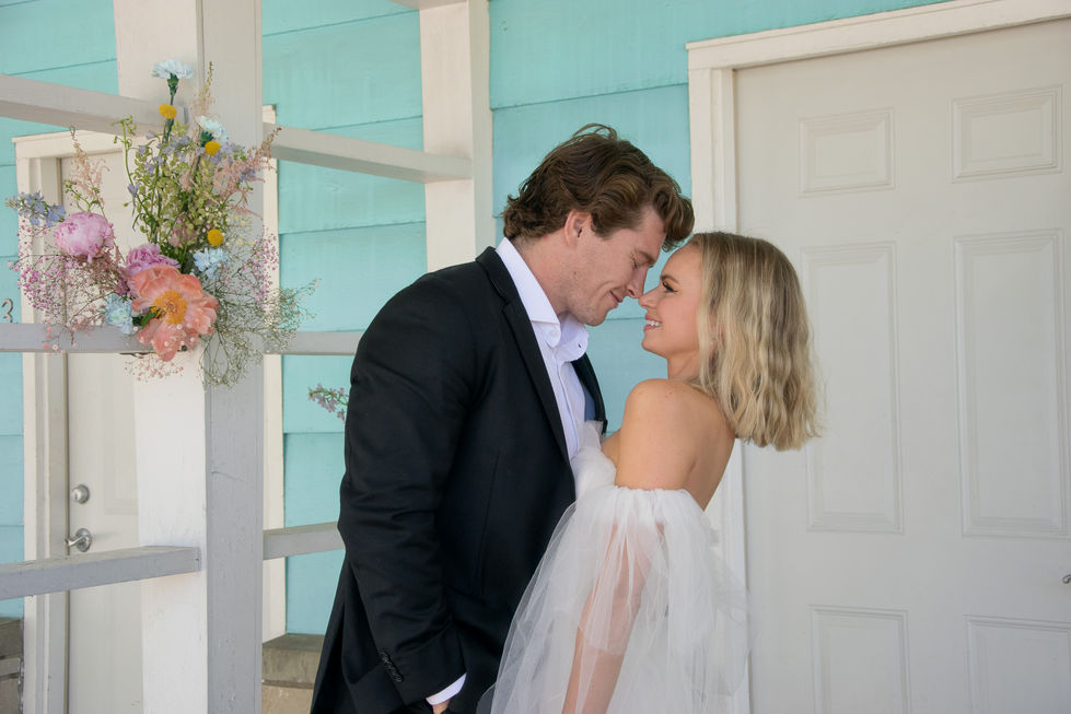 blonde bride and groom brushing noses and smiling at each other