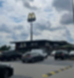 car in a parking lot outside of a McDonald's restaurant