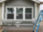 Home exterior with new siding and windows in gallery