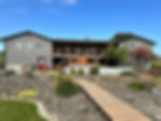 Modern grey house with wooden deck in the gallery