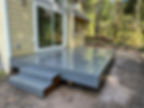 Modern grey composite deck in a residential gallery.