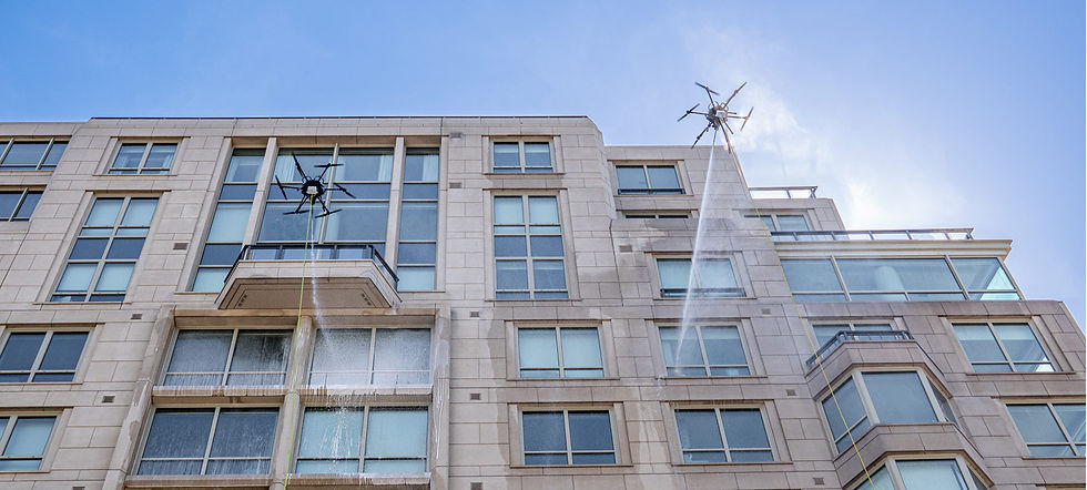 two-drones-cleaning-building-windows.jpg