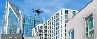 drone cleaning building windows.webp