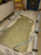 The test pool after six hours. The suit had to be knocked loose from the ice. The test subject reported no significant cold discomfort throughout.