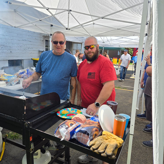 Cookout with two men cooking for groups event at The Father's Heart