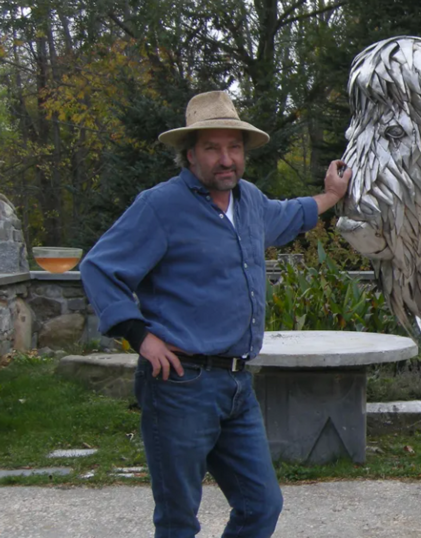 Artist Jay Seaman and a bison sculpture he created. Photo by Jennifer Wholey
