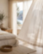 Amalfi Sand linen-look sheer curtains in a relaxed European-style bedroom