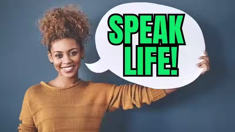 woman holding a speech bubble saying speak life