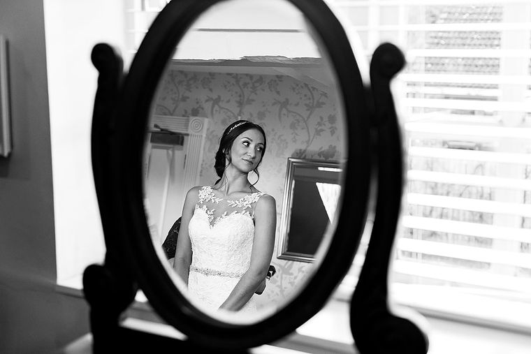 Reflection of bride in a mirror