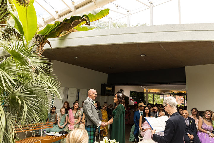 Wedding ceremony at Riverside Glass House in Jephson Gardens in Leamington Spa