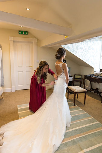 Bride gets into her dress