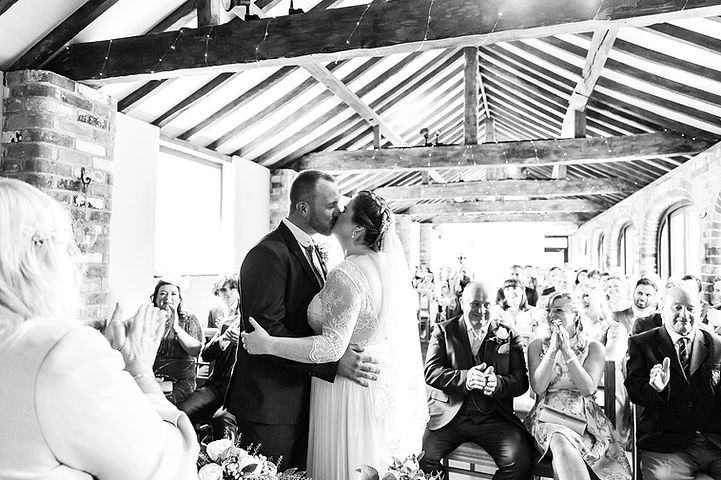 Bride and groom's first kiss at Dodmoor House