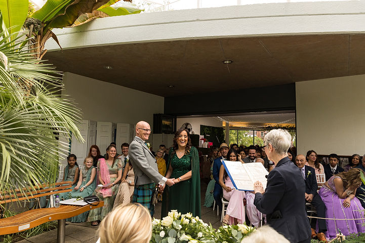 Wedding ceremony at Riverside Glass House in Jephson Gardens in Leamington Spa
