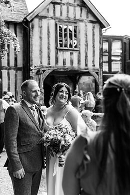 Candid photo of bride and groom at Cheylesmore Manor