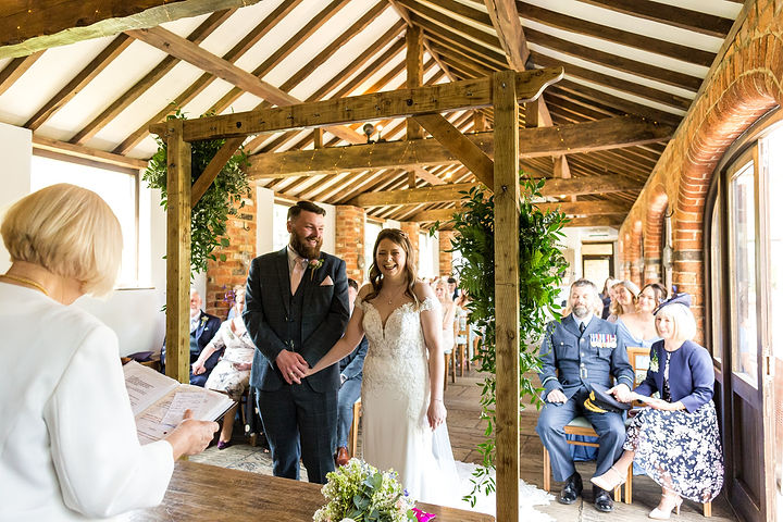 Bride and groom during their ceremony at Dodmoor House