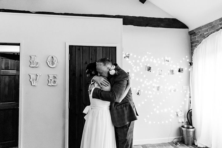Bride hugs her father at Dodmoor House