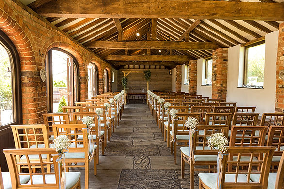 Courtyard Barn set for a ceremony at Dodmoor House